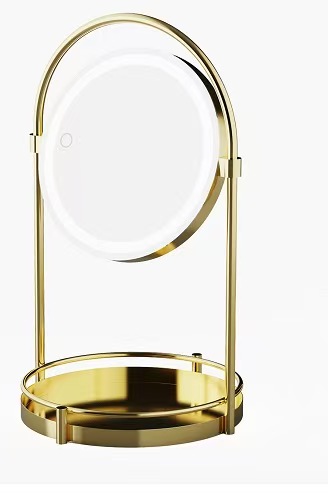 Round tabletop mirror with gold stand and catchall base